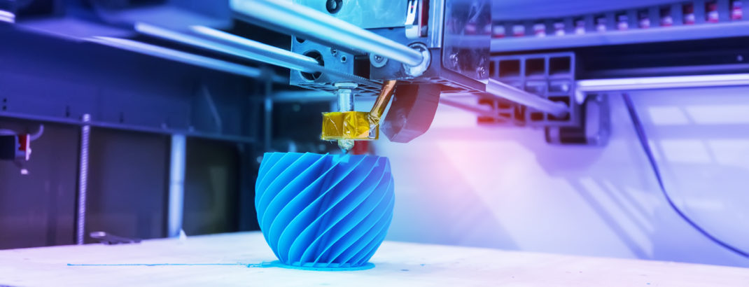 FDM 3D printer printing blue bowl.