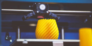 FDM 3D Printer printing yellow 3D object