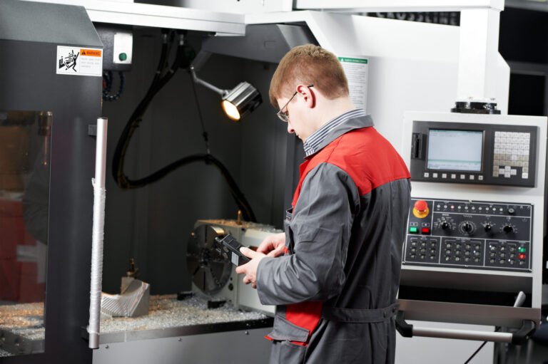 Engineer working on CNC Milling Machine