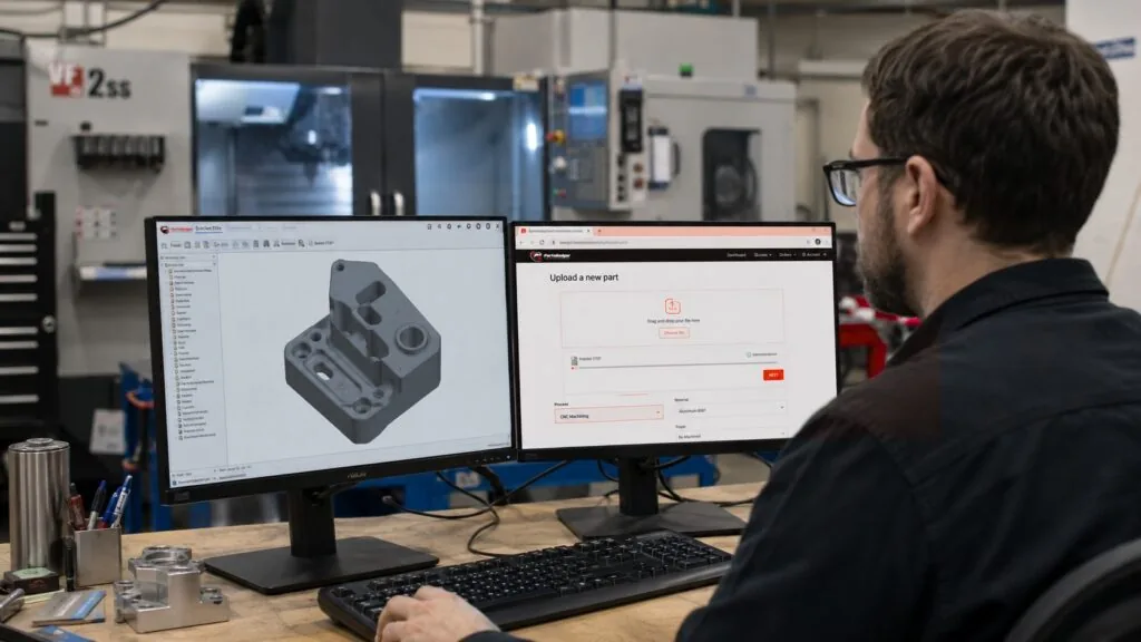 Engineer uploading CAD files to online CNC machining services for a custom quote.
